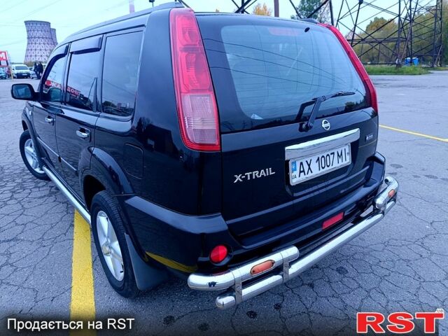 Черный Ниссан ИксТрейл, объемом двигателя 2.5 л и пробегом 170 тыс. км за 8600 $, фото 3 на Automoto.ua