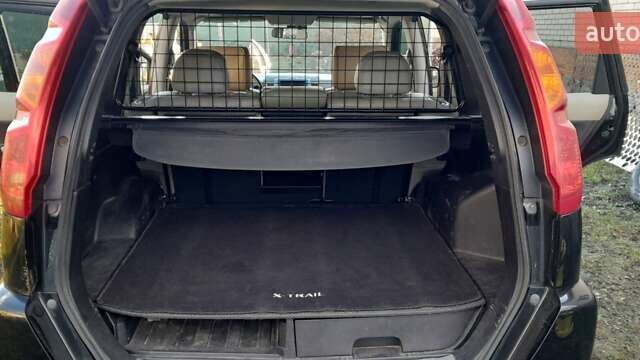 Черный Ниссан ИксТрейл, объемом двигателя 2 л и пробегом 259 тыс. км за 9999 $, фото 16 на Automoto.ua