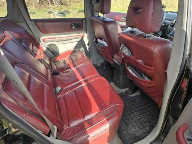 Черный Ниссан ИксТрейл, объемом двигателя 2.2 л и пробегом 206 тыс. км за 4000 $, фото 8 на Automoto.ua