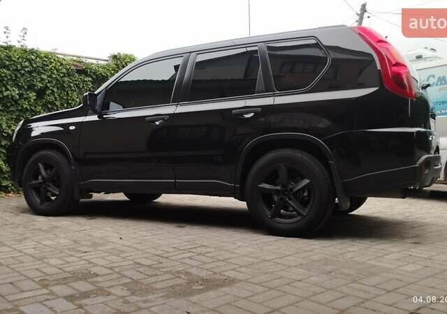 Черный Ниссан ИксТрейл, объемом двигателя 2 л и пробегом 140 тыс. км за 11600 $, фото 1 на Automoto.ua