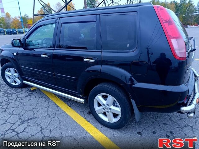 Черный Ниссан ИксТрейл, объемом двигателя 2.5 л и пробегом 170 тыс. км за 8600 $, фото 2 на Automoto.ua