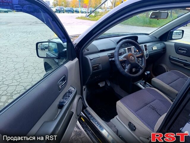 Черный Ниссан ИксТрейл, объемом двигателя 2.5 л и пробегом 170 тыс. км за 8600 $, фото 9 на Automoto.ua