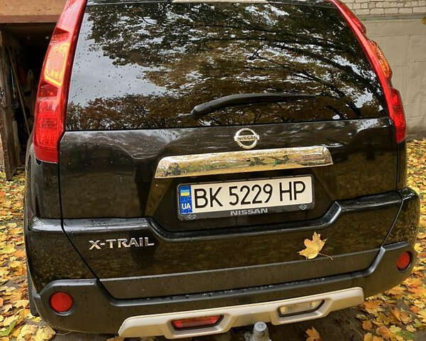Черный Ниссан ИксТрейл, объемом двигателя 2 л и пробегом 257 тыс. км за 9147 $, фото 6 на Automoto.ua