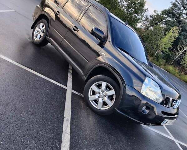 Черный Ниссан ИксТрейл, объемом двигателя 2 л и пробегом 284 тыс. км за 8500 $, фото 1 на Automoto.ua