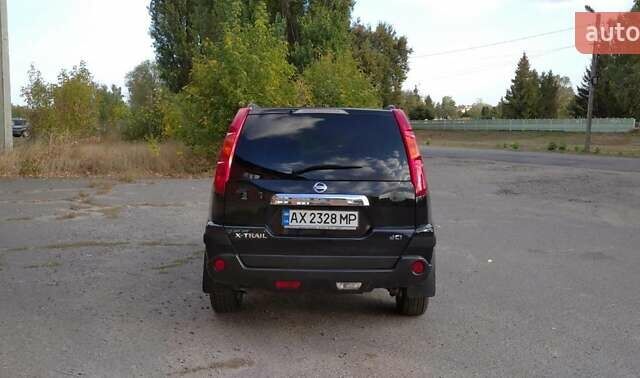 Черный Ниссан ИксТрейл, объемом двигателя 2 л и пробегом 240 тыс. км за 9700 $, фото 2 на Automoto.ua
