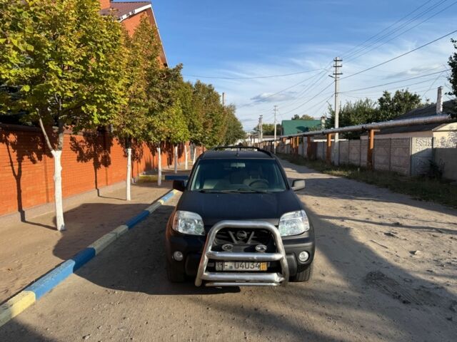 Черный Ниссан ИксТрейл, объемом двигателя 2 л и пробегом 200 тыс. км за 2950 $, фото 4 на Automoto.ua