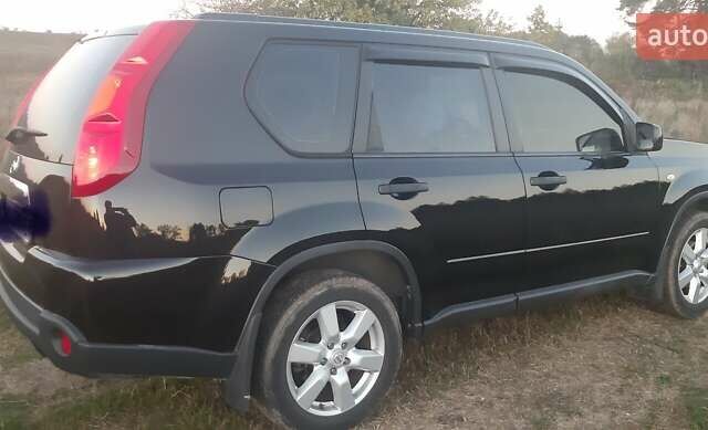 Черный Ниссан ИксТрейл, объемом двигателя 2 л и пробегом 182 тыс. км за 9300 $, фото 21 на Automoto.ua