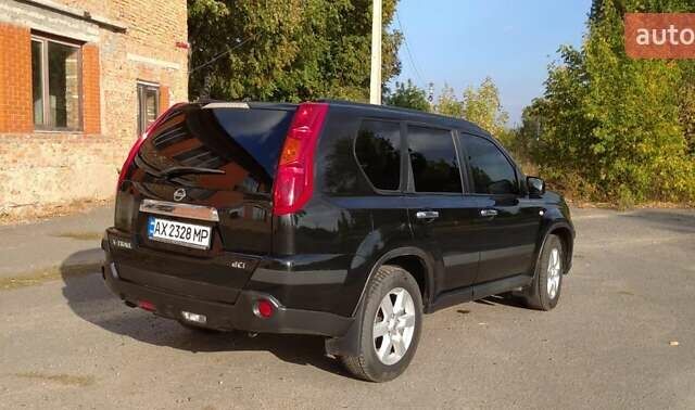 Черный Ниссан ИксТрейл, объемом двигателя 2 л и пробегом 240 тыс. км за 9700 $, фото 4 на Automoto.ua