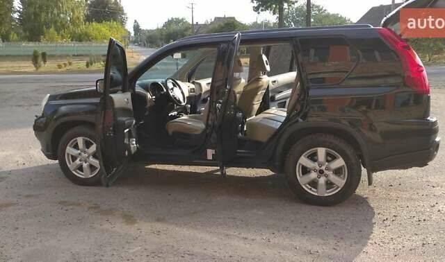 Черный Ниссан ИксТрейл, объемом двигателя 2 л и пробегом 240 тыс. км за 9700 $, фото 20 на Automoto.ua