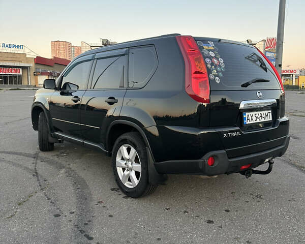 Черный Ниссан ИксТрейл, объемом двигателя 2 л и пробегом 305 тыс. км за 10700 $, фото 4 на Automoto.ua