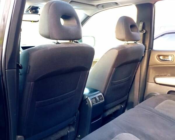 Черный Ниссан ИксТрейл, объемом двигателя 2 л и пробегом 238 тыс. км за 10500 $, фото 3 на Automoto.ua