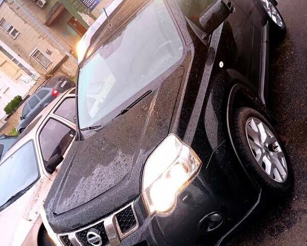 Черный Ниссан ИксТрейл, объемом двигателя 2 л и пробегом 238 тыс. км за 10500 $, фото 6 на Automoto.ua