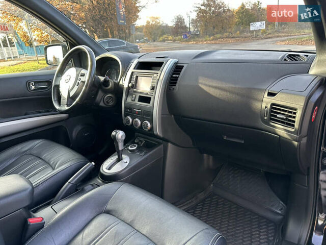 Чорний Ніссан ІксТрейл, об'ємом двигуна 2 л та пробігом 125 тис. км за 12999 $, фото 23 на Automoto.ua