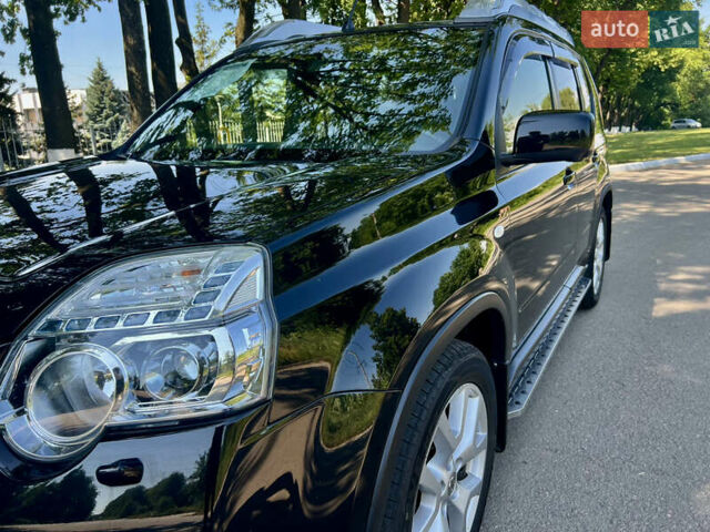 Черный Ниссан ИксТрейл, объемом двигателя 2 л и пробегом 125 тыс. км за 12300 $, фото 19 на Automoto.ua