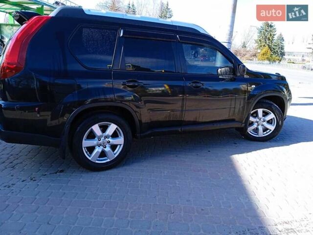 Черный Ниссан ИксТрейл, объемом двигателя 2 л и пробегом 230 тыс. км за 10400 $, фото 1 на Automoto.ua