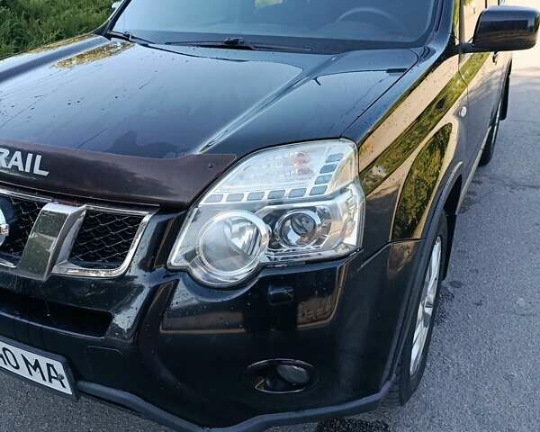 Черный Ниссан ИксТрейл, объемом двигателя 2 л и пробегом 132 тыс. км за 12800 $, фото 14 на Automoto.ua