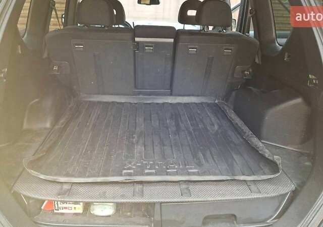 Черный Ниссан ИксТрейл, объемом двигателя 2 л и пробегом 213 тыс. км за 11950 $, фото 20 на Automoto.ua