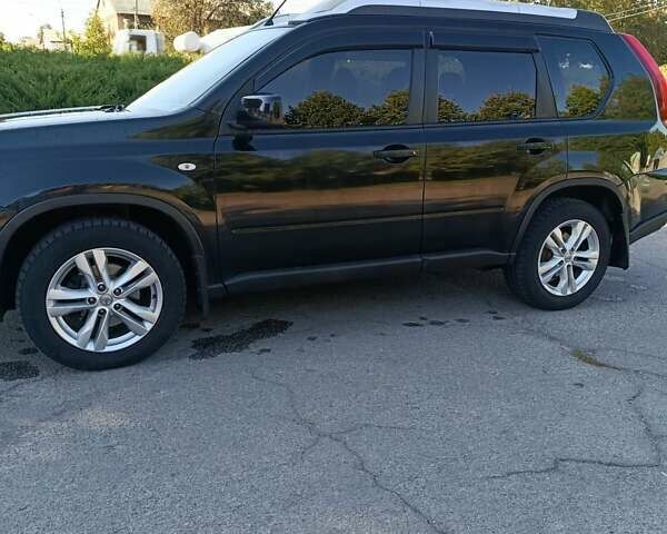 Черный Ниссан ИксТрейл, объемом двигателя 2 л и пробегом 132 тыс. км за 12800 $, фото 25 на Automoto.ua