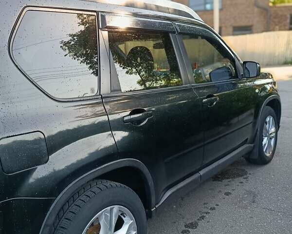 Черный Ниссан ИксТрейл, объемом двигателя 2 л и пробегом 132 тыс. км за 12800 $, фото 27 на Automoto.ua