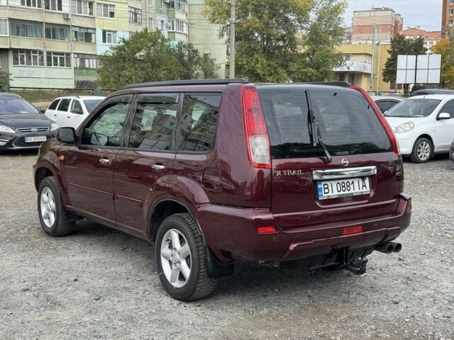Красный Ниссан ИксТрейл, объемом двигателя 2 л и пробегом 220 тыс. км за 6000 $, фото 2 на Automoto.ua