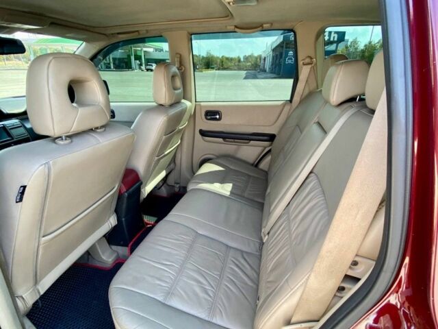 Красный Ниссан ИксТрейл, объемом двигателя 2.2 л и пробегом 337 тыс. км за 3599 $, фото 12 на Automoto.ua