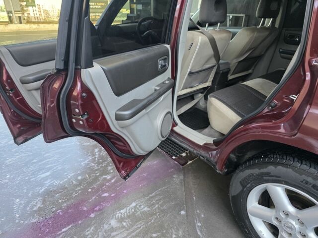 Червоний Ніссан ІксТрейл, об'ємом двигуна 2 л та пробігом 250 тис. км за 4499 $, фото 11 на Automoto.ua