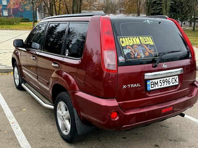 Красный Ниссан ИксТрейл, объемом двигателя 2.5 л и пробегом 270 тыс. км за 5600 $, фото 7 на Automoto.ua