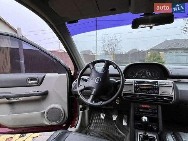 Красный Ниссан ИксТрейл, объемом двигателя 2 л и пробегом 227 тыс. км за 7250 $, фото 12 на Automoto.ua