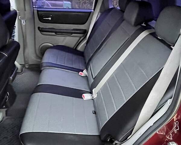 Красный Ниссан ИксТрейл, объемом двигателя 2 л и пробегом 227 тыс. км за 7250 $, фото 14 на Automoto.ua