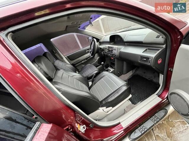 Красный Ниссан ИксТрейл, объемом двигателя 2 л и пробегом 227 тыс. км за 7250 $, фото 18 на Automoto.ua