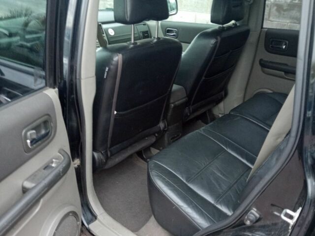 Красный Ниссан ИксТрейл, объемом двигателя 2.2 л и пробегом 335 тыс. км за 5008 $, фото 9 на Automoto.ua