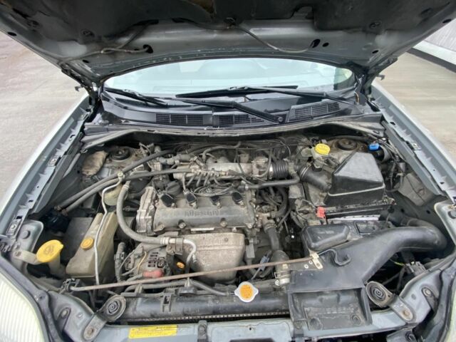 Серый Ниссан ИксТрейл, объемом двигателя 2 л и пробегом 330 тыс. км за 6000 $, фото 4 на Automoto.ua