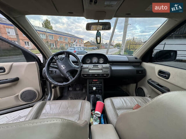 Серый Ниссан ИксТрейл, объемом двигателя 2 л и пробегом 249 тыс. км за 4999 $, фото 20 на Automoto.ua