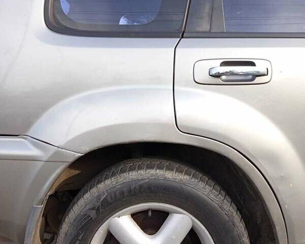 Серый Ниссан ИксТрейл, объемом двигателя 2 л и пробегом 231 тыс. км за 5300 $, фото 15 на Automoto.ua