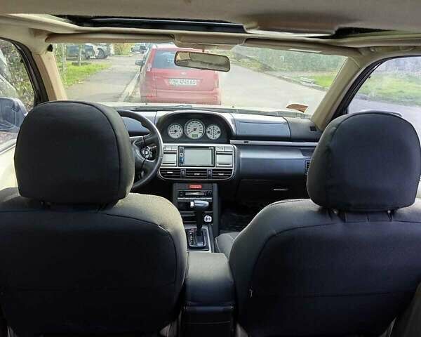 Серый Ниссан ИксТрейл, объемом двигателя 2 л и пробегом 231 тыс. км за 5300 $, фото 5 на Automoto.ua