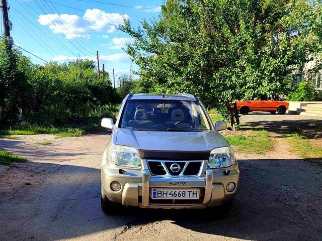 Сірий Ніссан ІксТрейл, об'ємом двигуна 2.5 л та пробігом 390 тис. км за 5000 $, фото 4 на Automoto.ua