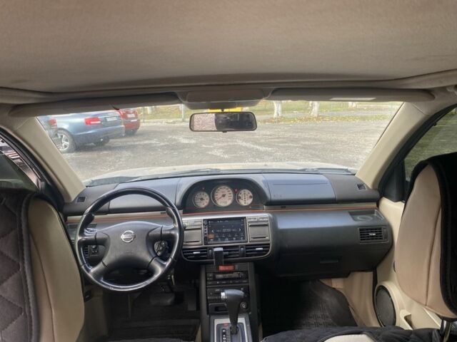 Серый Ниссан ИксТрейл, объемом двигателя 2 л и пробегом 200 тыс. км за 4950 $, фото 5 на Automoto.ua