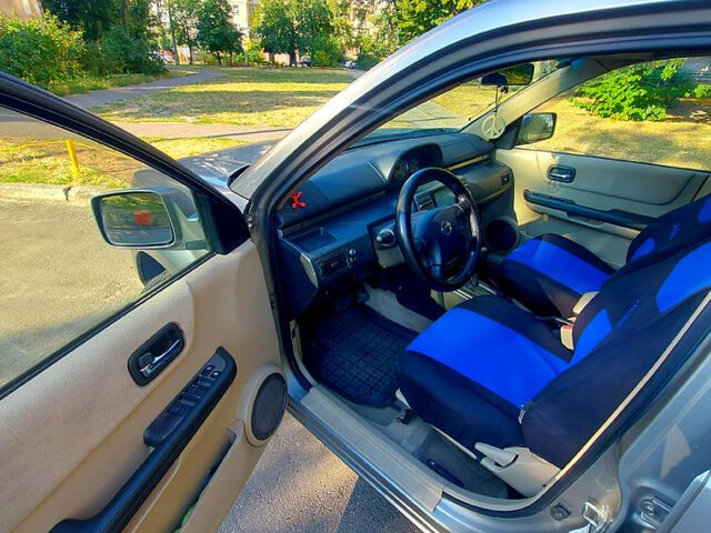 Сірий Ніссан ІксТрейл, об'ємом двигуна 2 л та пробігом 305 тис. км за 5200 $, фото 6 на Automoto.ua