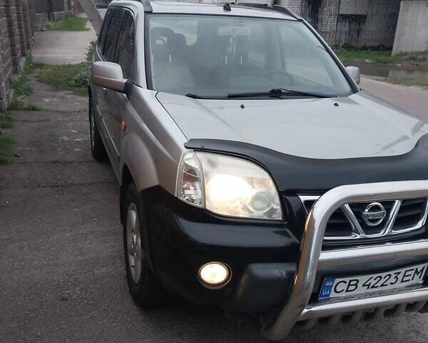 Серый Ниссан ИксТрейл, объемом двигателя 2 л и пробегом 335 тыс. км за 5999 $, фото 6 на Automoto.ua