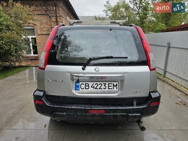 Сірий Ніссан ІксТрейл, об'ємом двигуна 2 л та пробігом 335 тис. км за 4800 $, фото 7 на Automoto.ua