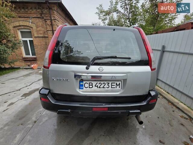 Серый Ниссан ИксТрейл, объемом двигателя 2 л и пробегом 335 тыс. км за 4900 $, фото 11 на Automoto.ua