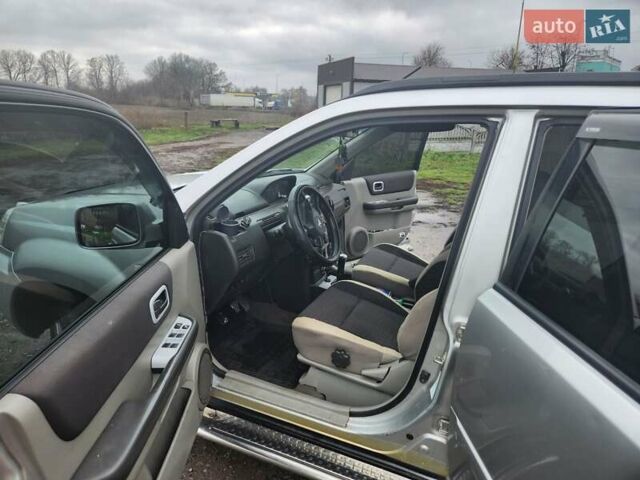 Серый Ниссан ИксТрейл, объемом двигателя 2.5 л и пробегом 450 тыс. км за 7000 $, фото 11 на Automoto.ua