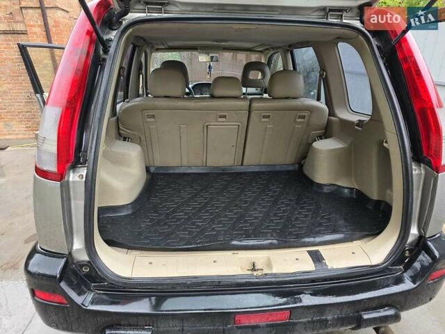 Сірий Ніссан ІксТрейл, об'ємом двигуна 2 л та пробігом 335 тис. км за 4800 $, фото 21 на Automoto.ua