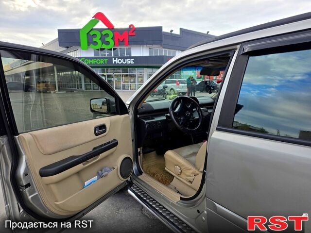 Серый Ниссан ИксТрейл, объемом двигателя 2 л и пробегом 220 тыс. км за 5800 $, фото 4 на Automoto.ua