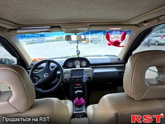 Серый Ниссан ИксТрейл, объемом двигателя 2 л и пробегом 220 тыс. км за 5800 $, фото 3 на Automoto.ua