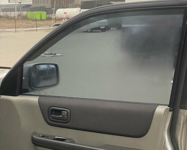 Серый Ниссан ИксТрейл, объемом двигателя 2 л и пробегом 246 тыс. км за 4499 $, фото 10 на Automoto.ua