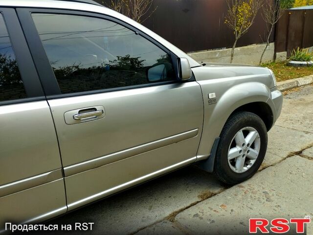 Серый Ниссан ИксТрейл, объемом двигателя 2.2 л и пробегом 240 тыс. км за 6700 $, фото 2 на Automoto.ua