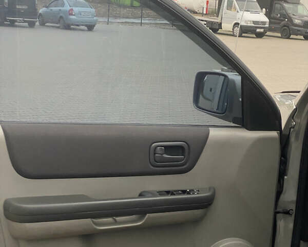 Серый Ниссан ИксТрейл, объемом двигателя 2 л и пробегом 246 тыс. км за 4499 $, фото 19 на Automoto.ua