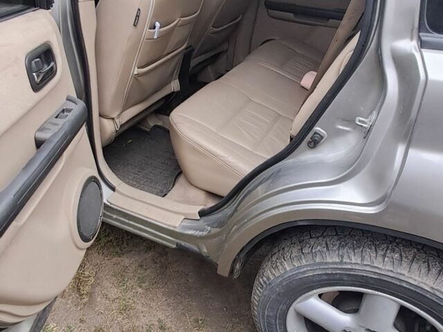 Серый Ниссан ИксТрейл, объемом двигателя 2 л и пробегом 290 тыс. км за 4950 $, фото 8 на Automoto.ua