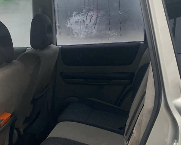 Серый Ниссан ИксТрейл, объемом двигателя 2 л и пробегом 246 тыс. км за 4499 $, фото 15 на Automoto.ua